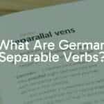 A German language textbook with the words 'trennbare Verben' highlighted, surrounded by scattered German verb prefixes like 'aus', 'ein', 'mit', educational vibe, clean and modern style.