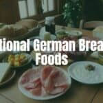 A traditional German breakfast spread with fresh bread, assorted cheeses, cold cuts, and jams on a wooden table, warm morning light, cozy and inviting.