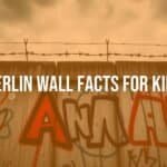 A section of the Berlin Wall with graffiti, barbed wire on top, gloomy sky, historical, realistic.