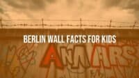 A section of the Berlin Wall with graffiti, barbed wire on top, gloomy sky, historical, realistic.