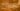 Traditional German kitchen with a wooden table filled with hearty dishes like sausages, pretzels, and stew, rustic and cozy atmosphere, warm lighting, realistic.