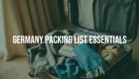 A stylish open suitcase with travel essentials for Germany, including a scarf, comfortable shoes, a guidebook, and a smartphone, set in a cozy room with warm lighting, realistic.